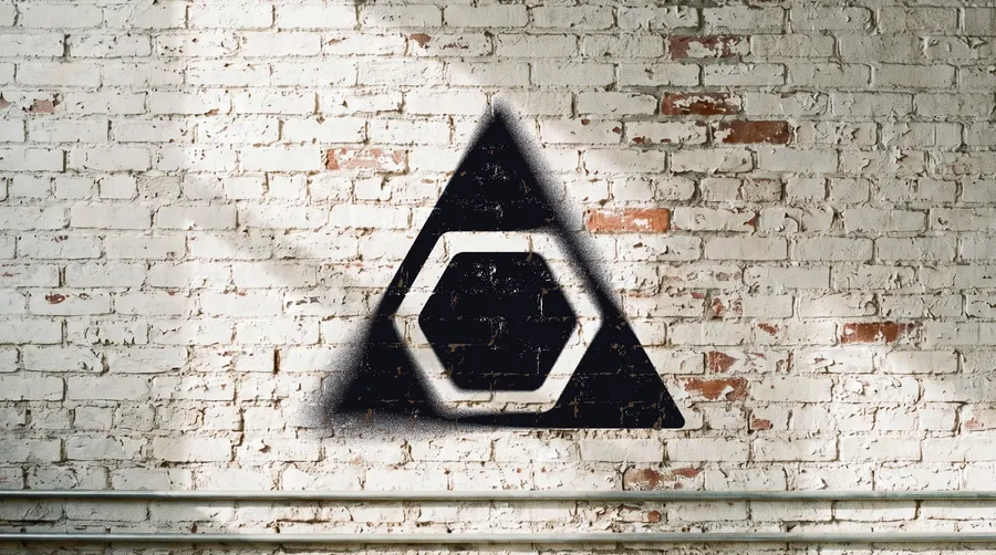 The A3Lab mark spray-stenciled in black on a white brick wall